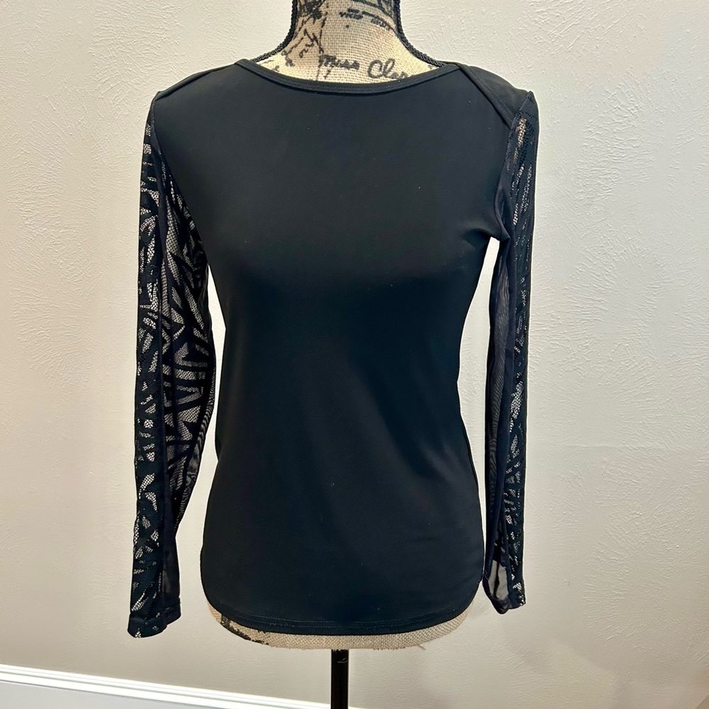 Joseph Ribkoff black top with lace sleeves. Size 6. Good condition. Non smoke